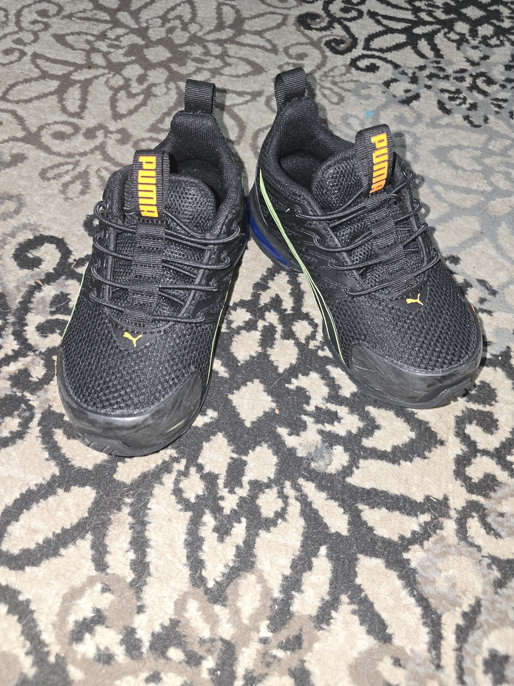 Puma Kids Black Mesh Sneakers with Orange Logo and Green Trim